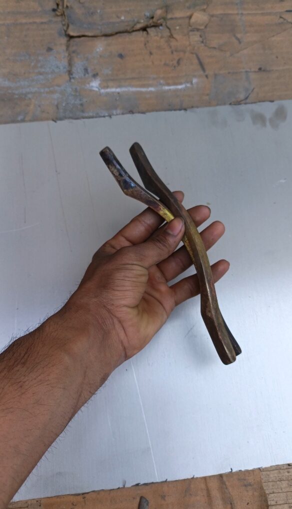 Stripping tarnish from brass handles at NK Electroplating